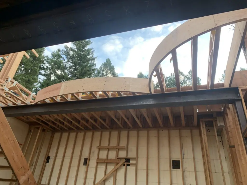 Curved roof framing inside cabin structure