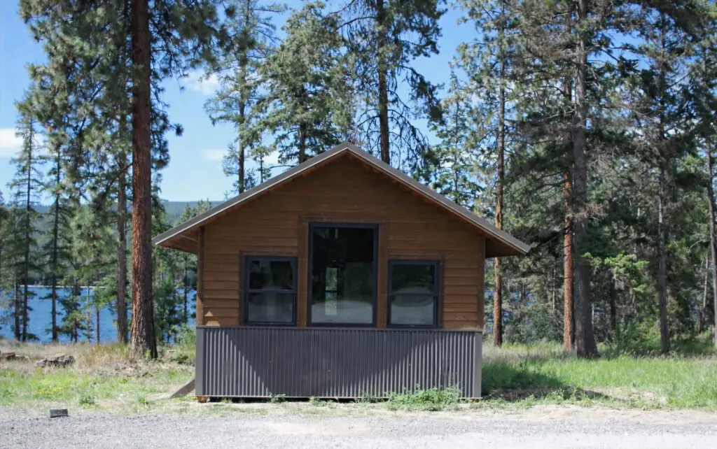 Cabin exterior in a wooded setting