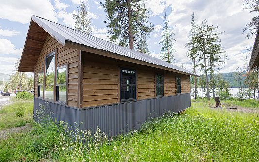 Panoramic cabin exterior with large windows