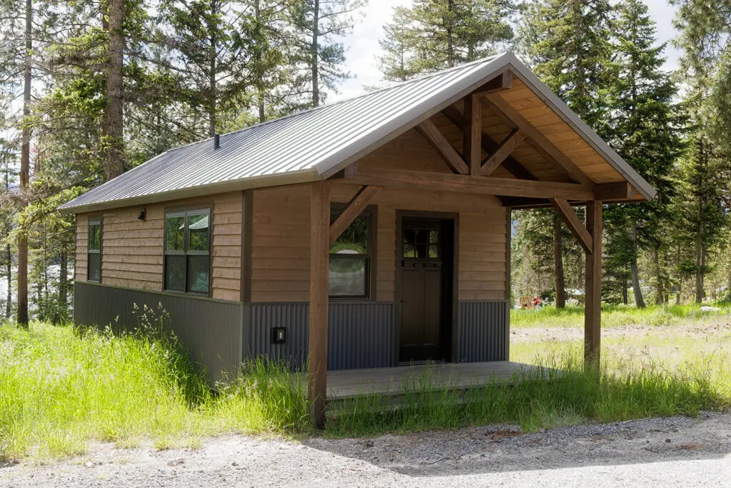 Cabin exterior in a wooded setting